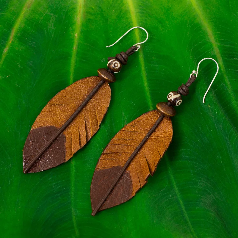 Hoop earrings with hammered copper for a warm and rustic aesthetic-Brown Feather Feather-Shaped Earrings Crafted from Leather, Bone and Wood