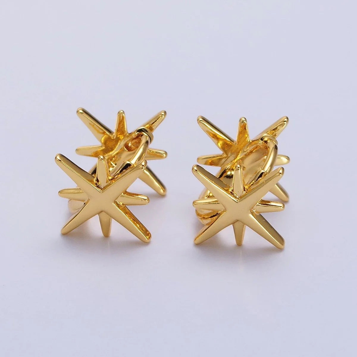 Hoop earrings with open designs for a modern, lighthearted vibe-Double Star Huggies