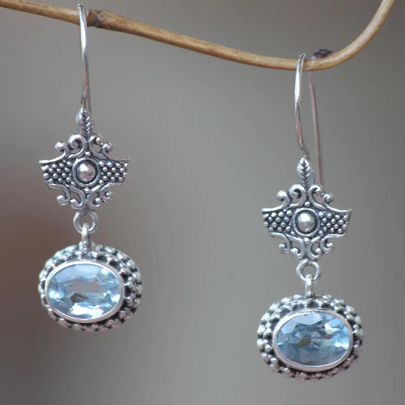 Hoop earrings with removable pendants for a versatile and customizable accessory-Serene Gaze Handcrafted Blue Topaz and Sterling Silver Earrings