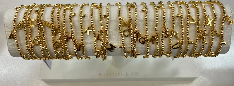 Best bangle bracelets with stacked designs for a trendy and fashionable look-A Little Gold Alphabet Bracelet