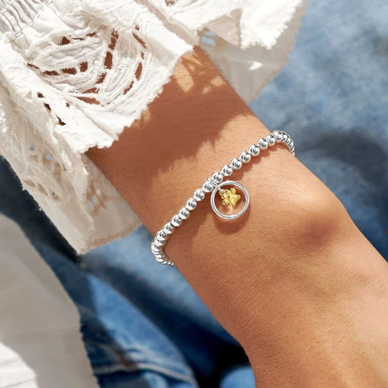 Gold bangle bracelets for women with a minimalist and sleek design-A Little 'Pets Leave Pawprints On Our Hearts' Bracelet