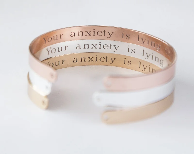 Best bangle bracelets with minimalist geometric designs for a contemporary, edgy look-Your Anxiety Is Lying To You Bracelet, Engraved Secret Message